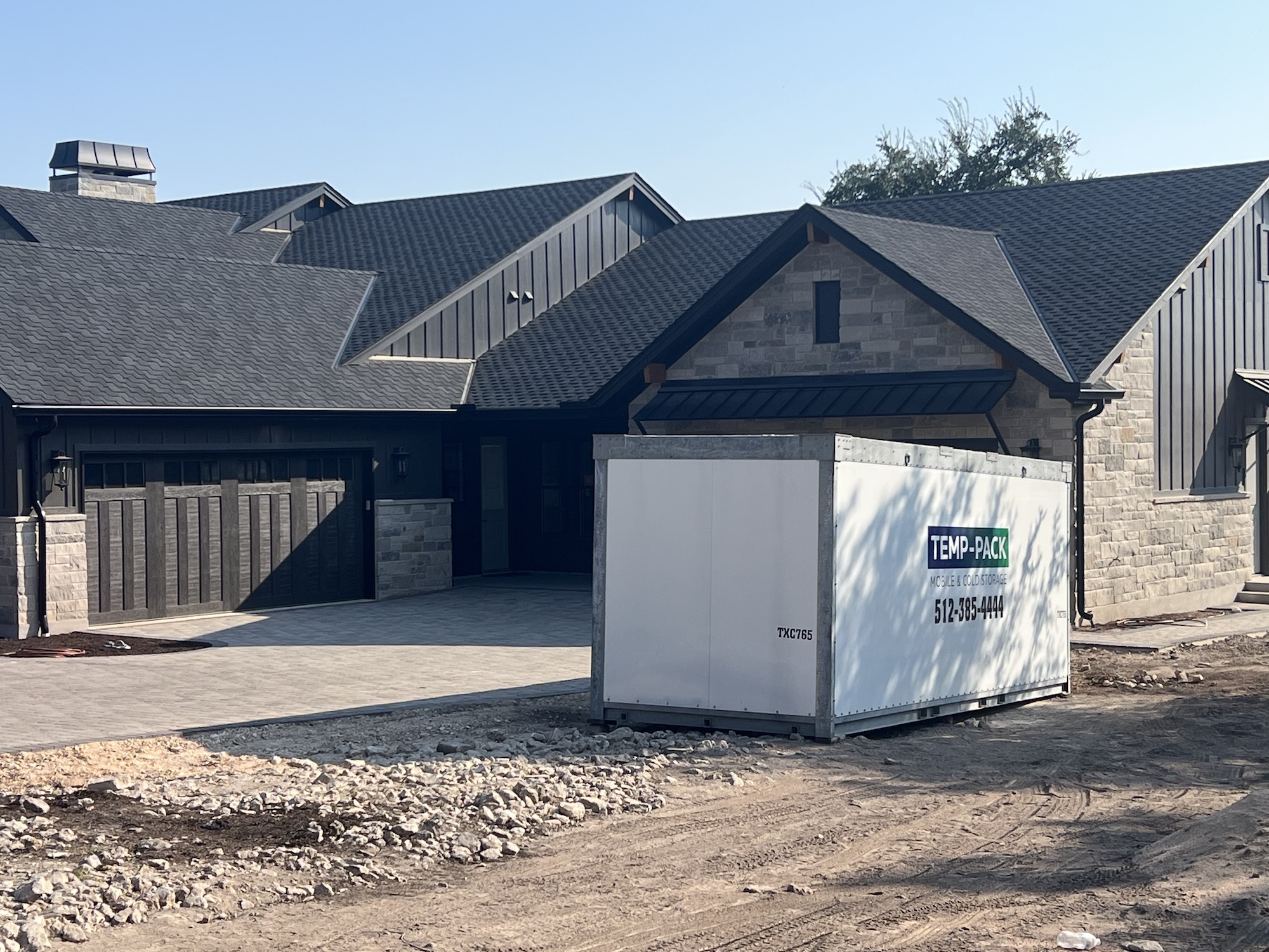 TEMP-PACK storage container outside a home under construction