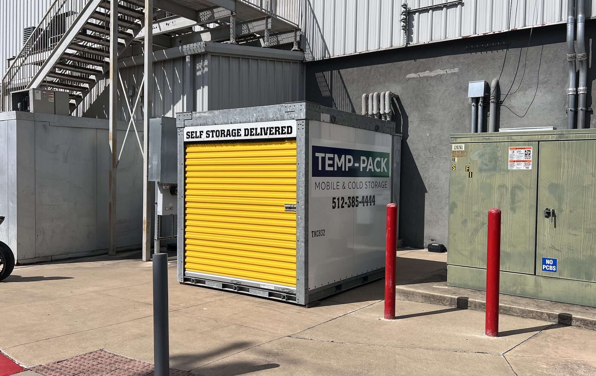 TEMP-PACK storage container beside an exterior staircase